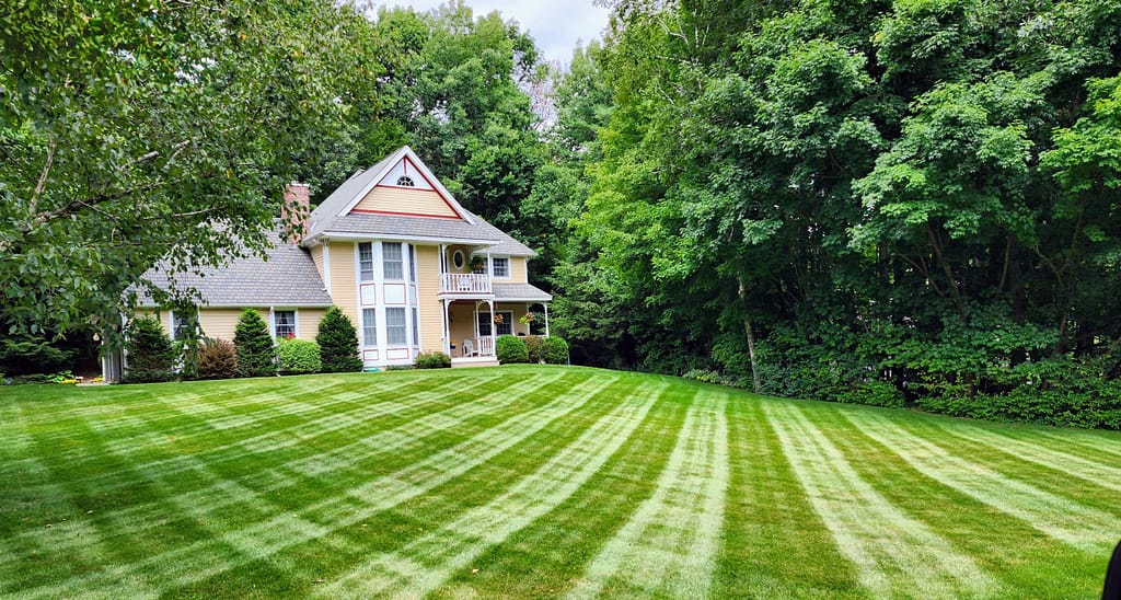 Unlocking the Secrets to Affordable Lawn Care: Your Guide to a Stunning Yard on a Budget 1 manicured lawn in Queensbury
